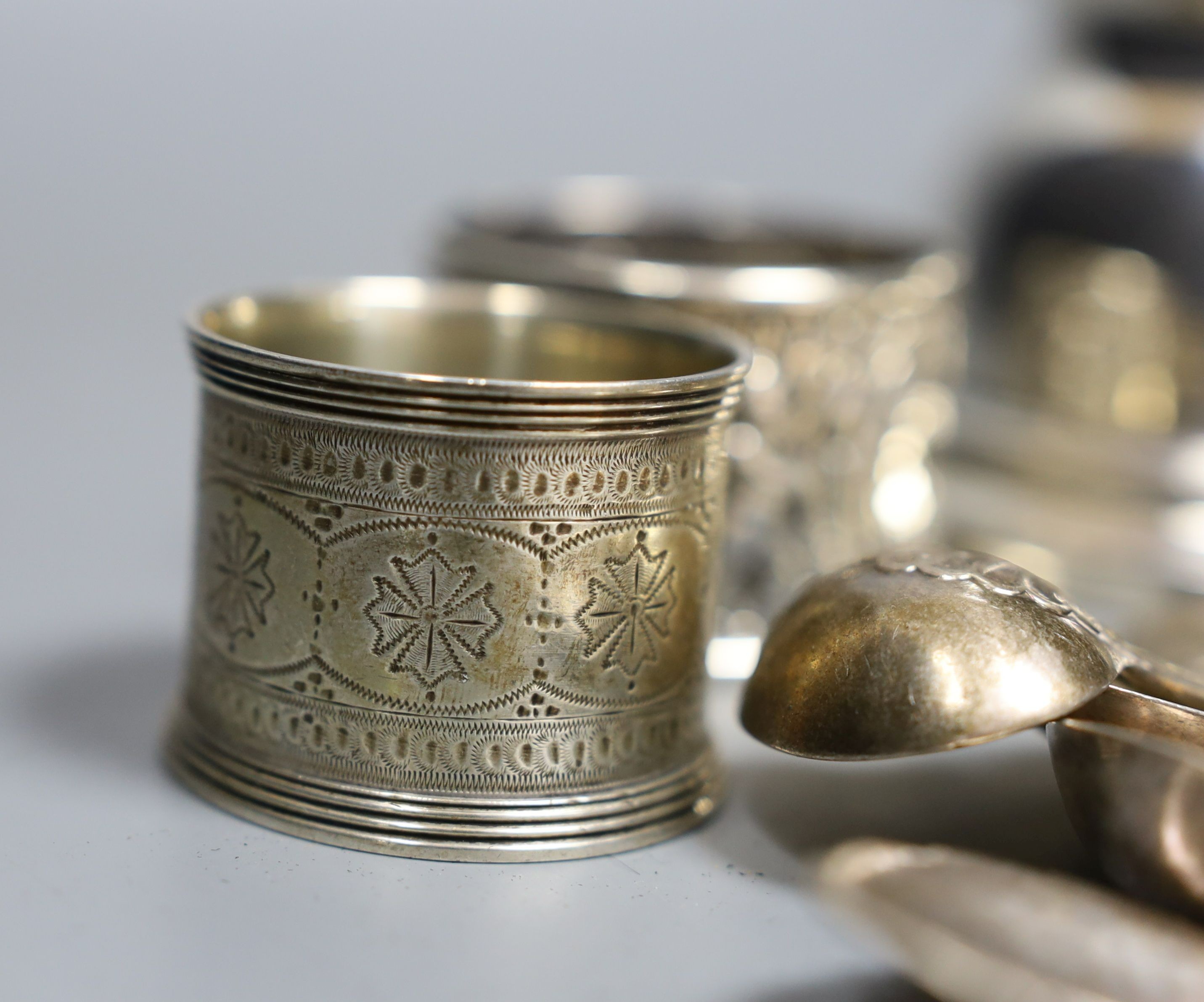 Assorted small silver including flatware, napkin rings, tortoiseshell mounted inkwell, two coins and a Georg Jensen sterling preserve spoon, no. 41.